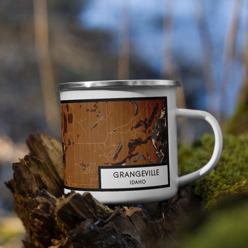 Right View Custom Grangeville Idaho Map Enamel Mug in Ember on Grass With Trees in Background