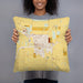 Person holding 18x18 Custom Grangeville Idaho Map Throw Pillow in Woodblock