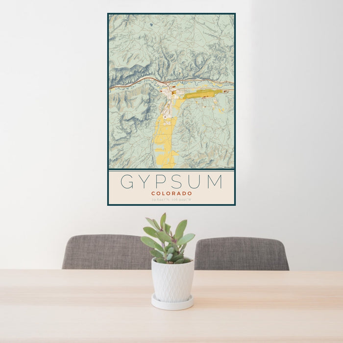 24x36 Gypsum Colorado Map Print Portrait Orientation in Woodblock Style Behind 2 Chairs Table and Potted Plant