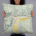 Person holding 22x22 Custom Gypsum Colorado Map Throw Pillow in Woodblock