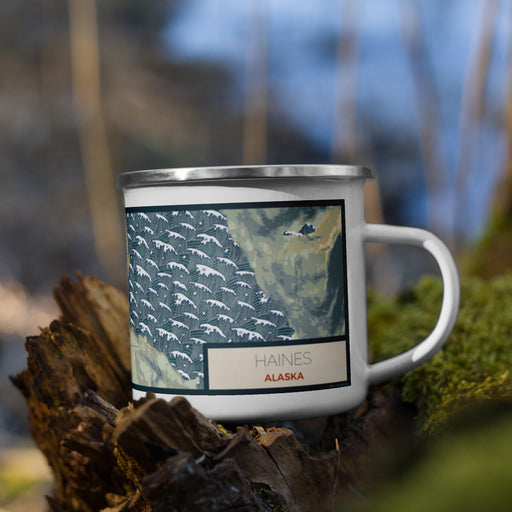 Right View Custom Haines Alaska Map Enamel Mug in Woodblock on Grass With Trees in Background
