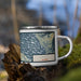 Right View Custom Haines Alaska Map Enamel Mug in Woodblock on Grass With Trees in Background