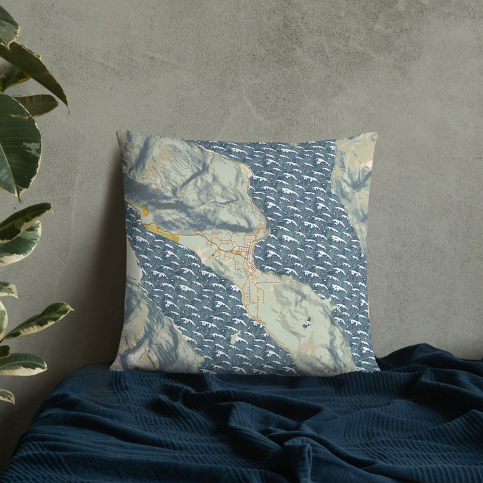 Custom Haines Alaska Map Throw Pillow in Woodblock on Bedding Against Wall