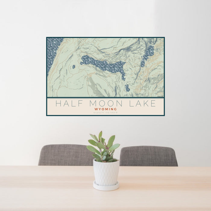 24x36 Half Moon Lake Wyoming Map Print Lanscape Orientation in Woodblock Style Behind 2 Chairs Table and Potted Plant