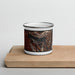 Front View Custom Half Moon Lake Wyoming Map Enamel Mug in Ember on Cutting Board