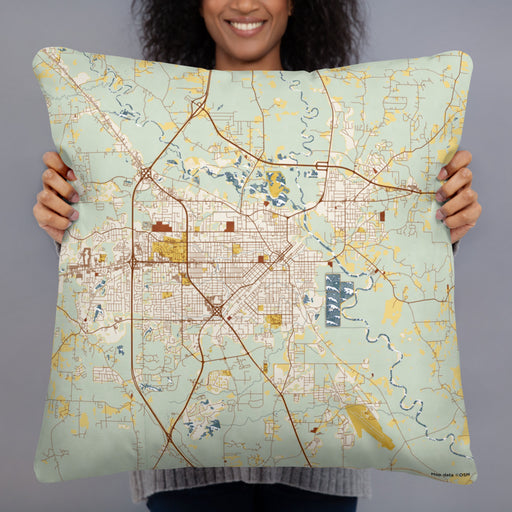 Person holding 22x22 Custom Hattiesburg Mississippi Map Throw Pillow in Woodblock