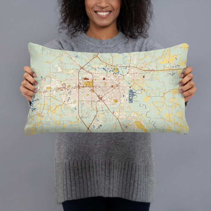 Person holding 20x12 Custom Hattiesburg Mississippi Map Throw Pillow in Woodblock