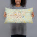 Person holding 20x12 Custom Hattiesburg Mississippi Map Throw Pillow in Woodblock