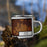 Right View Custom Havre Montana Map Enamel Mug in Ember on Grass With Trees in Background
