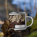 Right View Custom Helper Utah Map Enamel Mug in Ember on Grass With Trees in Background