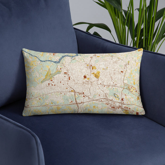 Custom Hickory North Carolina Map Throw Pillow in Woodblock on Blue Colored Chair
