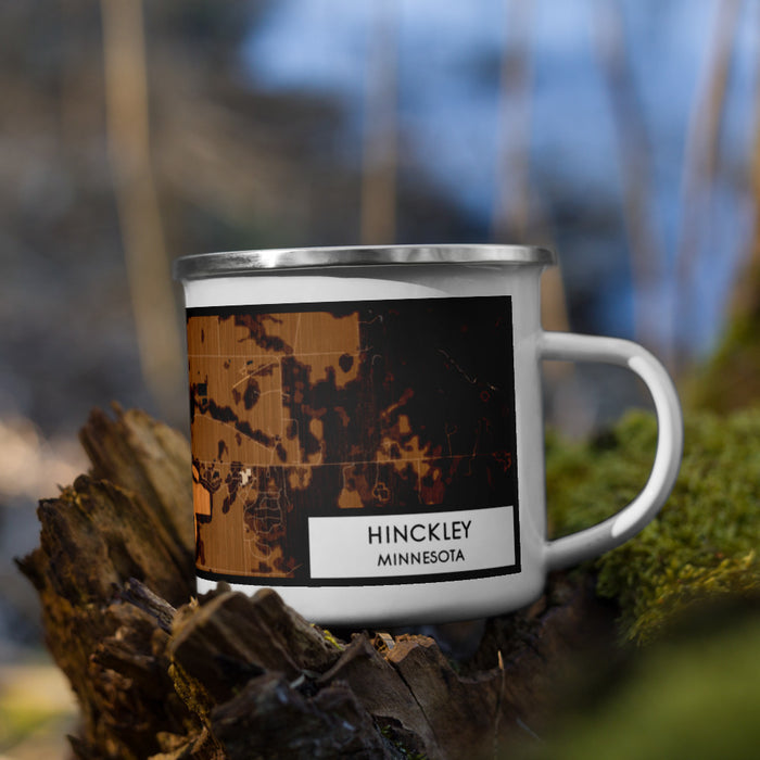 Right View Custom Hinckley Minnesota Map Enamel Mug in Ember on Grass With Trees in Background