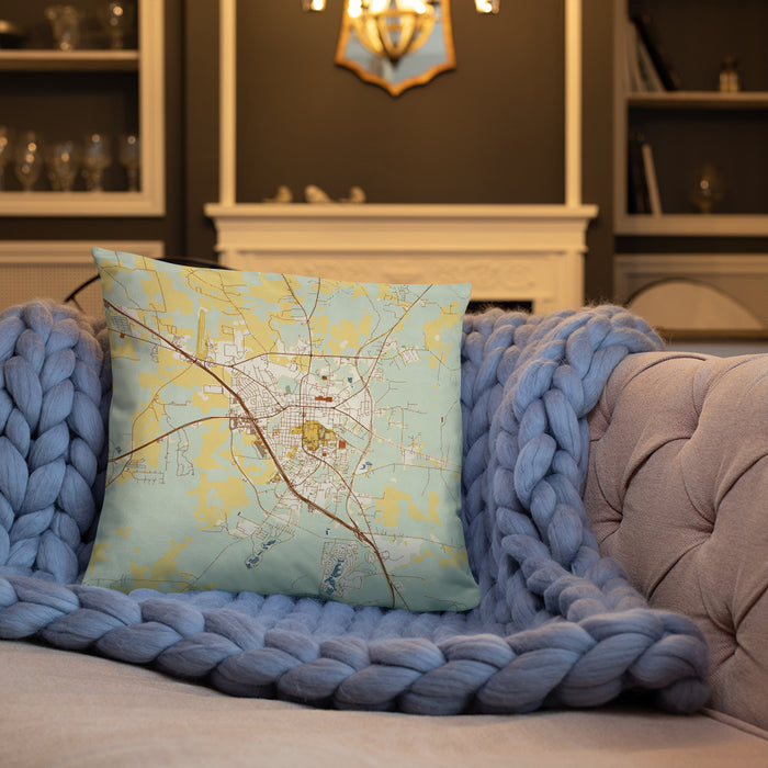 Custom Huntsville Texas Map Throw Pillow in Woodblock on Cream Colored Couch