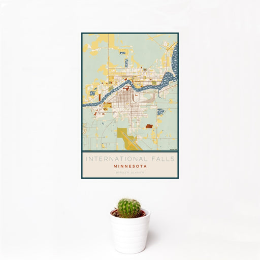 12x18 International Falls Minnesota Map Print Portrait Orientation in Woodblock Style With Small Cactus Plant in White Planter