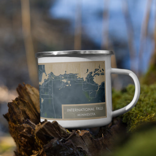 Right View Custom International Falls Minnesota Map Enamel Mug in Afternoon on Grass With Trees in Background