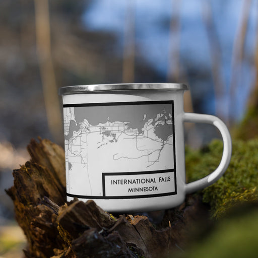 Right View Custom International Falls Minnesota Map Enamel Mug in Classic on Grass With Trees in Background