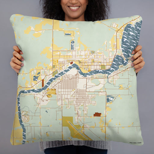 Person holding 22x22 Custom International Falls Minnesota Map Throw Pillow in Woodblock