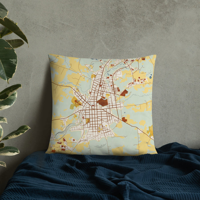 Custom Johnstown New York Map Throw Pillow in Woodblock on Bedding Against Wall