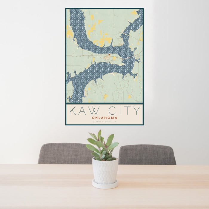 24x36 Kaw City Oklahoma Map Print Portrait Orientation in Woodblock Style Behind 2 Chairs Table and Potted Plant