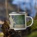 Right View Custom Kaw City Oklahoma Map Enamel Mug in Afternoon on Grass With Trees in Background