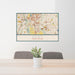 24x36 Kent Washington Map Print Lanscape Orientation in Woodblock Style Behind 2 Chairs Table and Potted Plant