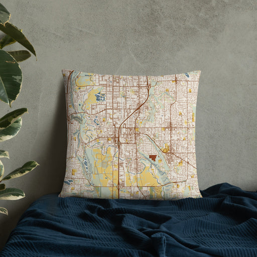 Custom Kent Washington Map Throw Pillow in Woodblock on Bedding Against Wall