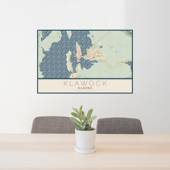 24x36 Klawock Alaska Map Print Landscape Orientation in Woodblock Style Behind 2 Chairs Table and Potted Plant
