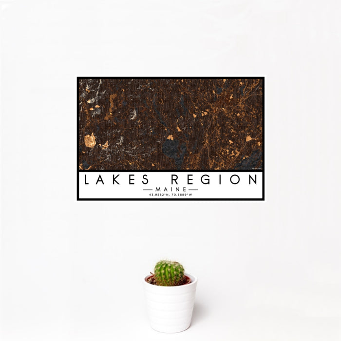 12x18 Lakes Region Maine Map Print Landscape Orientation in Ember Style With Small Cactus Plant in White Planter