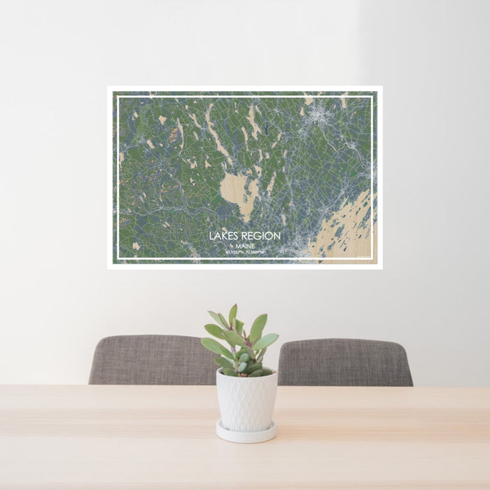 24x36 Lakes Region Maine Map Print Lanscape Orientation in Afternoon Style Behind 2 Chairs Table and Potted Plant