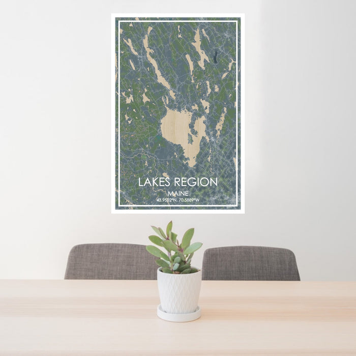 24x36 Lakes Region Maine Map Print Portrait Orientation in Afternoon Style Behind 2 Chairs Table and Potted Plant