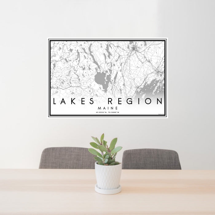 24x36 Lakes Region Maine Map Print Lanscape Orientation in Classic Style Behind 2 Chairs Table and Potted Plant