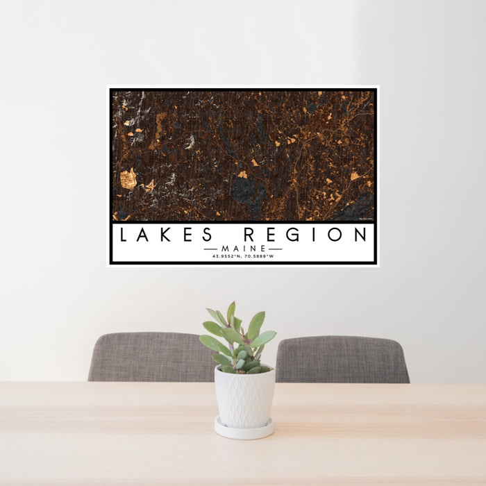 24x36 Lakes Region Maine Map Print Lanscape Orientation in Ember Style Behind 2 Chairs Table and Potted Plant