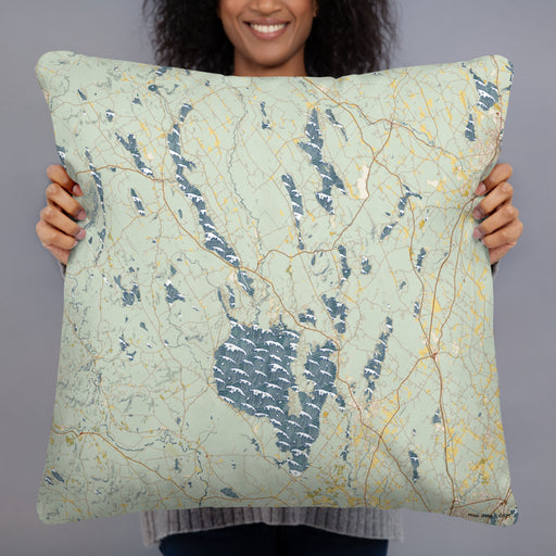 Person holding 22x22 Custom Lakes Region Maine Map Throw Pillow in Woodblock