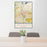 24x36 Lancaster California Map Print Portrait Orientation in Woodblock Style Behind 2 Chairs Table and Potted Plant