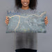 Person holding 20x12 Custom Lewiston Idaho Map Throw Pillow in Afternoon