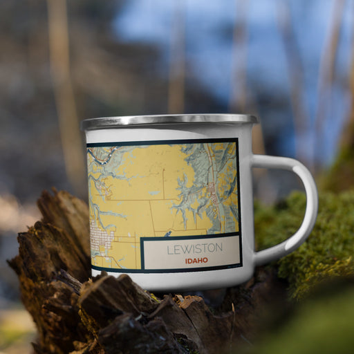 Right View Custom Lewiston Idaho Map Enamel Mug in Woodblock on Grass With Trees in Background
