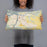 Person holding 20x12 Custom Lewiston Idaho Map Throw Pillow in Woodblock