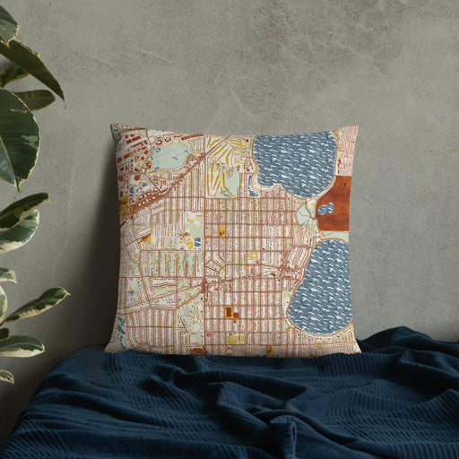 Custom Linden Hills Minnesota Map Throw Pillow in Woodblock on Bedding Against Wall