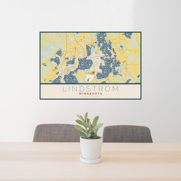 24x36 Lindstrom Minnesota Map Print Lanscape Orientation in Woodblock Style Behind 2 Chairs Table and Potted Plant