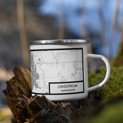 Right View Custom Lindstrom Minnesota Map Enamel Mug in Classic on Grass With Trees in Background