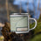 Right View Custom Llano Texas Map Enamel Mug in Woodblock on Grass With Trees in Background