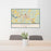 24x36 Logan Ohio Map Print Lanscape Orientation in Woodblock Style Behind 2 Chairs Table and Potted Plant