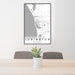 24x36 Ludington Michigan Map Print Portrait Orientation in Classic Style Behind 2 Chairs Table and Potted Plant