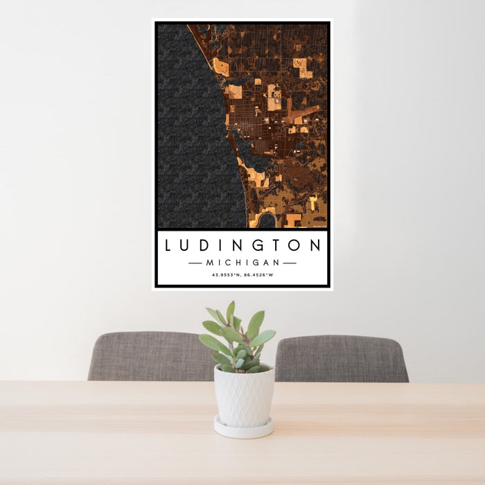 24x36 Ludington Michigan Map Print Portrait Orientation in Ember Style Behind 2 Chairs Table and Potted Plant