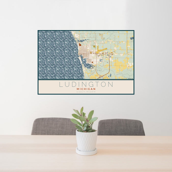 24x36 Ludington Michigan Map Print Lanscape Orientation in Woodblock Style Behind 2 Chairs Table and Potted Plant