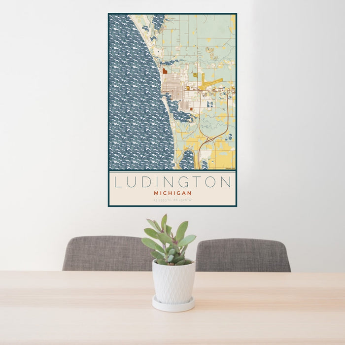 24x36 Ludington Michigan Map Print Portrait Orientation in Woodblock Style Behind 2 Chairs Table and Potted Plant