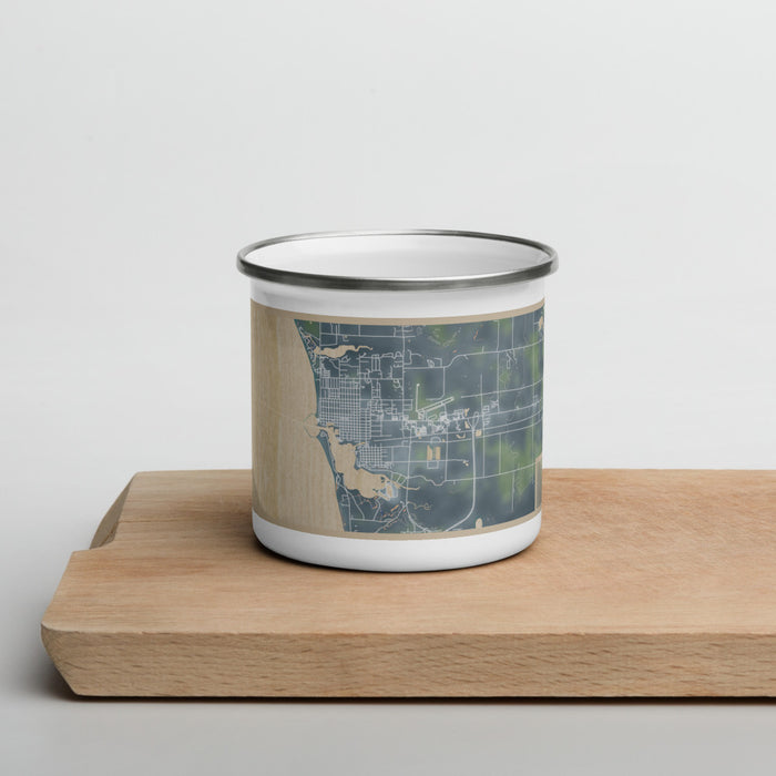 Front View Custom Ludington Michigan Map Enamel Mug in Afternoon on Cutting Board