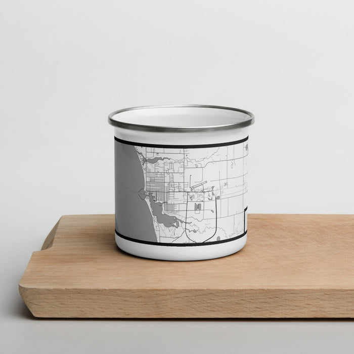 Front View Custom Ludington Michigan Map Enamel Mug in Classic on Cutting Board