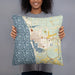 Person holding 18x18 Custom Ludington Michigan Map Throw Pillow in Woodblock