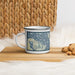Left View Custom Lummi Island Washington Map Enamel Mug in Woodblock on Table Top